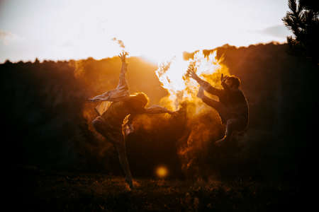 The two young modern ballet dancers training dance routine in the natureの写真素材