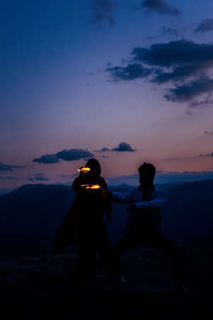 Summer holidays, love, relationship and dating concept - smiling couple dancing on the mountain...
