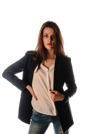 Stylish fashion girl posing in trendy clothes against white backgroundの写真素材