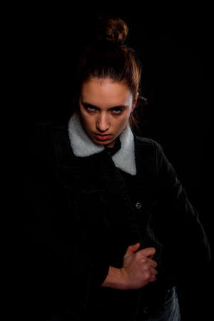 Studio body shot of a fashion female model posing in modern clothingの写真素材