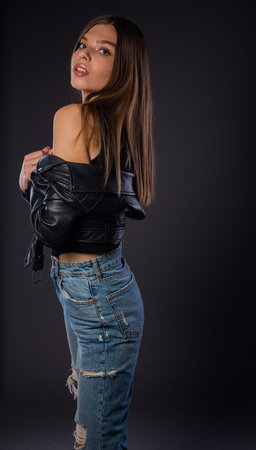 Body shot of an attractive female model posing in modern style clothesの写真素材