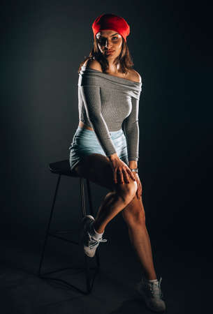Portrait of an attractive young woman dressed in stylish clothingの写真素材