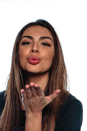 Close up shot of a cool modern girl making a kiss sending gestureの写真素材