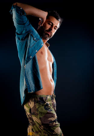 Full body shot of a trendy young man wearing modern style clothesの写真素材