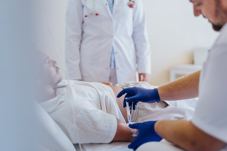 Specialist doctor providing healthcare and medicine to a patient receiving infusion and fluid therapy in a hospital room.の写真素材