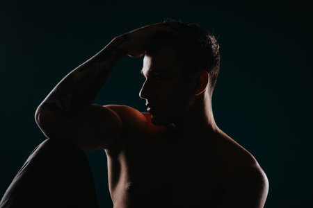 Confident Fitness Instructor Showing Muscles for Body Transformation Goalsの写真素材