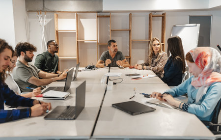 Corporate business team on a meeting with their middle-aged managerの写真素材