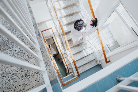 Healthcare professionals collaborating in a modern clinic, discussing medical results and diagnoses to provide successful treatment outcomes.の写真素材