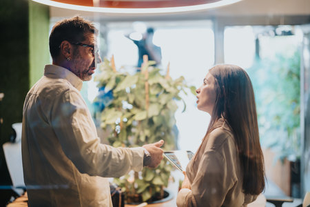 Successful Business Partners Discussing Efficient Strategies for Growth and Profitの写真素材