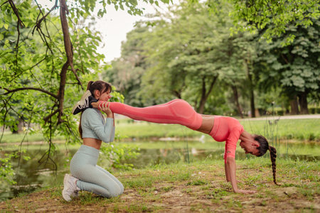 Active Friends Exercising and Stretching Outdoors in the City Park