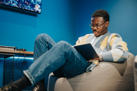 Experienced Business Person Analyzing Market Data in Modern Downtown Officeの写真素材