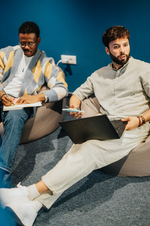 Experienced businessman leads multinational team discussing profitable market research and online...