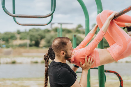 Females Exercising Outdoors for a Healthy and Active Lifestyle - Fit Girls Training Stamina and Stretching Legs in Urban Parkの写真素材
