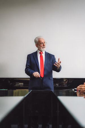 Senior businessman talking during meeting at conference room.の写真素材
