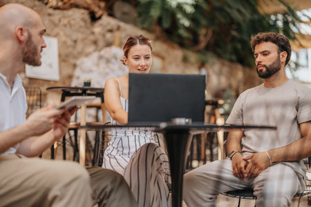 A confident, focused business team discussing statistics, planning projects, and optimizing...