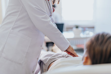 A doctor provides healthcare and medicine, administering infusion therapy to a patient in a hospital room, ensuring accurate diagnosis and treatment.の写真素材