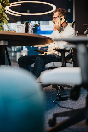 Experienced Business Employee Analyzing Market Data in Modern Downtown Officeの写真素材