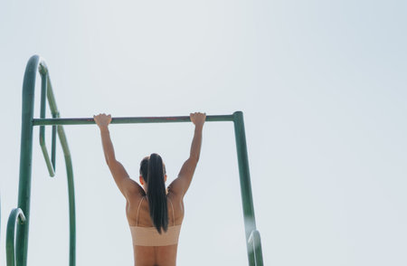 Friends Challenge Themselves with Outdoor Pull-up Workout in Sunny Park