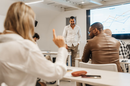 Good looking middle-aged male professor teaching sales his studentsの写真素材