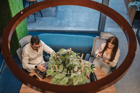 Multiracial Businesspeople Networking in Modern Downtown Office for Successful Market Research and Project Managementの写真素材