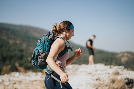 Enthusiastic Hikers Explore Beautiful Mountain Trail Amidst Lush Greenery on a Sunny Day