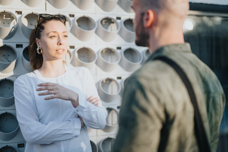 Successful Business Partners Discussing Project Details Outdoorsの写真素材