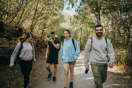 Group of Friends Enjoying a Hike in the Mountainous Wilderness on a Sunny Dayの写真素材