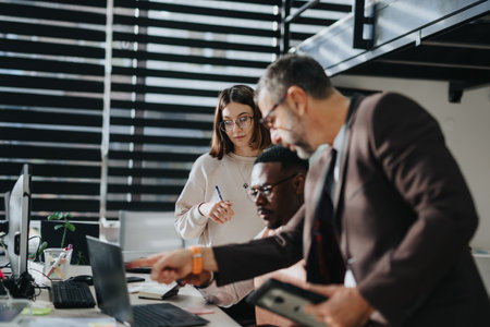 Professionals collaborate on business strategies, market analysis, and financial statistics in a corporate office, aiming for growth and success.の写真素材