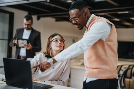 A diverse business team strategizes for market expansion and profit growth, collaborating and analyzing financial statistics for sustainable success.の写真素材