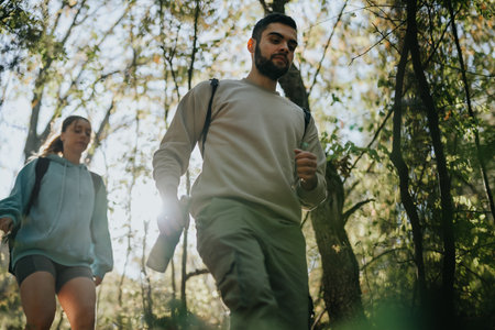 Adventure Seekers Enjoy a Sunny Day Hike in the Refreshing Mountain Wilderness with Friendsの写真素材
