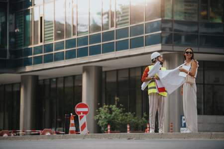 Architects and engineers discuss a sustainable design project at a construction site in the city.