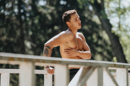 Friends Pushing Their Limits in the Park, a Sunny Day Full of Outdoor Workouts and Sportsmanshipの写真素材