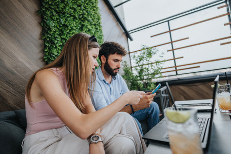 A business couple discusses growth strategies and new projects during an outdoor meeting in the city...
