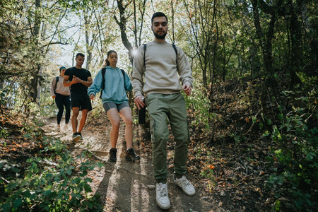 Friends Hiking in the Wilderness: Enjoying a Sunny Day Outdoors with Physical Activity and Natural...
