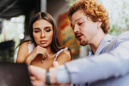 Architects, designers, and engineers discuss project finances and materials, collaborating on sustainable design and urban planning.の写真素材