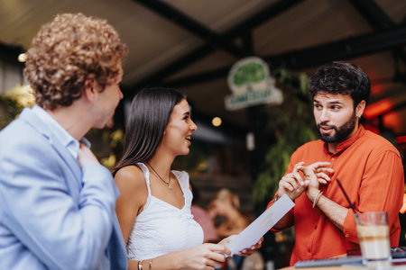 A diverse team of architects, designers, and engineers discuss project costs, sustainable design, and innovation in urban planning.の写真素材