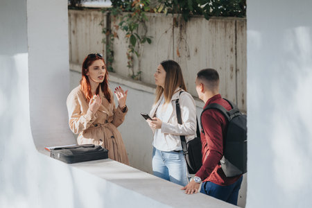 Business professionals in the city collaborating and brainstorming strategies for business expansion and profit growth in a small startup team.の写真素材