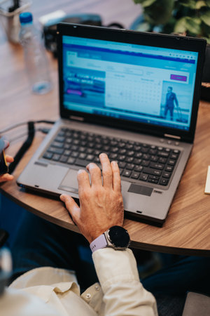 Confident Business Employee Analyzing Market Data in Modern City Center Workspaceの写真素材