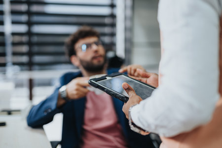 Business team strategizing in an office, analyzing financial statistics, and planning for global expansion and growth.の写真素材