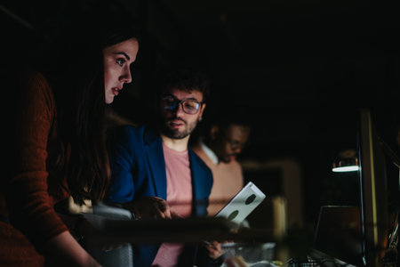 Multicultural business team collaborating on project development, financial planning, and sales strategies to achieve business growth.の写真素材
