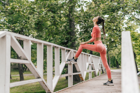 Active Female Exercising Outdoors in a City Park - Fitness and Motivation in Urban Environment