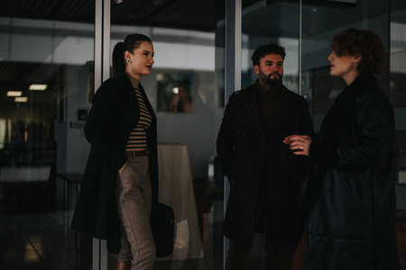 Young entrepreneurs collaborating on business growth strategies in a city. Focus on market research,...