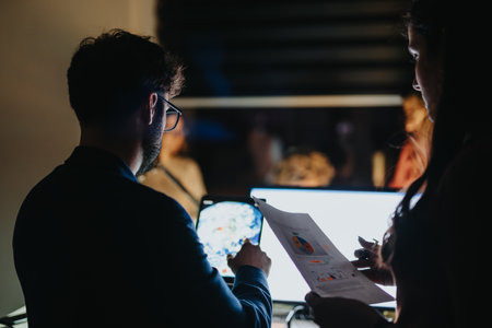 Late Night Collaboration. Persistent Business People Working on Business Growth and Strategies.の写真素材