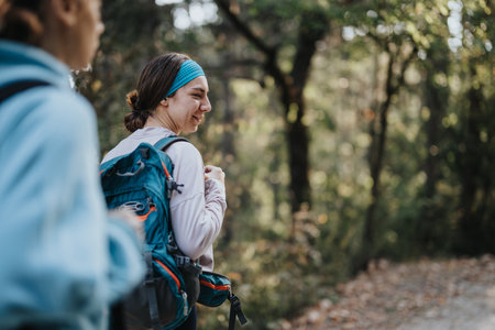 Group of Friends Enjoying Healthy Hike in Autumn Landscapeの写真素材