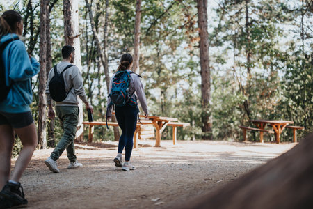 A Group of Friends Enjoy a Healthy Hike in the Autumn Wildernessの写真素材
