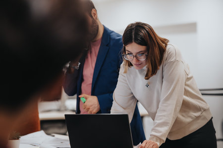 Creative Business Team Analyzing Reports for Financial Planning and Business Growth