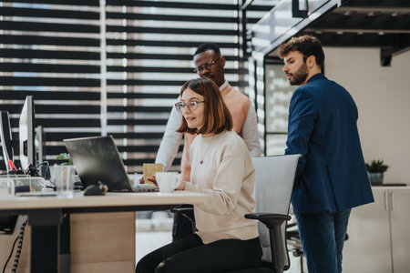 Diverse business team collaborates in a modern office, discussing strategies, sales, and market analysis for sustainable growth and innovation.の写真素材