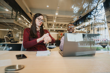 Multiracial coworkers collaborating in a creative office for business development