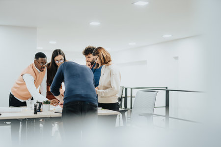 Collaboration for Business Growth. Multiracial Corporate Team Analyzing Reports and Discussing Project Details.の写真素材