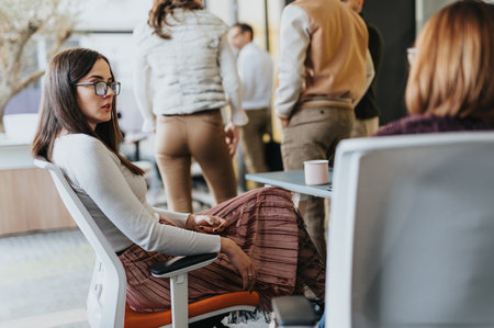 Successful business employees analyzing statistics and discussing financial planning for profit growth in the global marketの写真素材